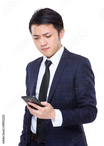 Businessman look at cellphone © leungchopan
