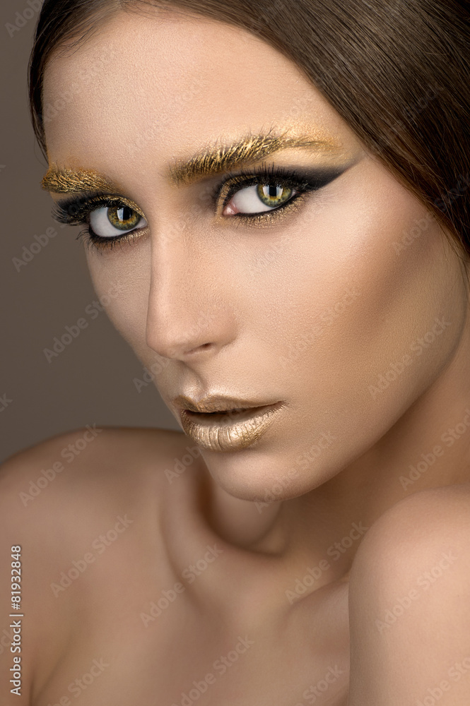 Fototapeta premium Beauty woman with gold make-up