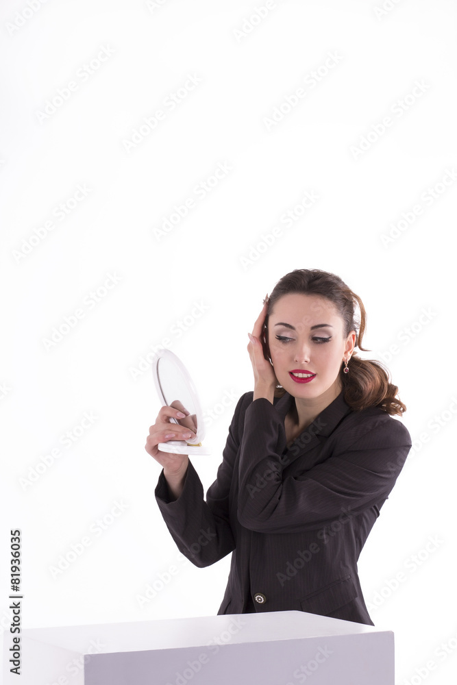 businesswoman looking in a hand mirror businesswoman looking in a hand mirror