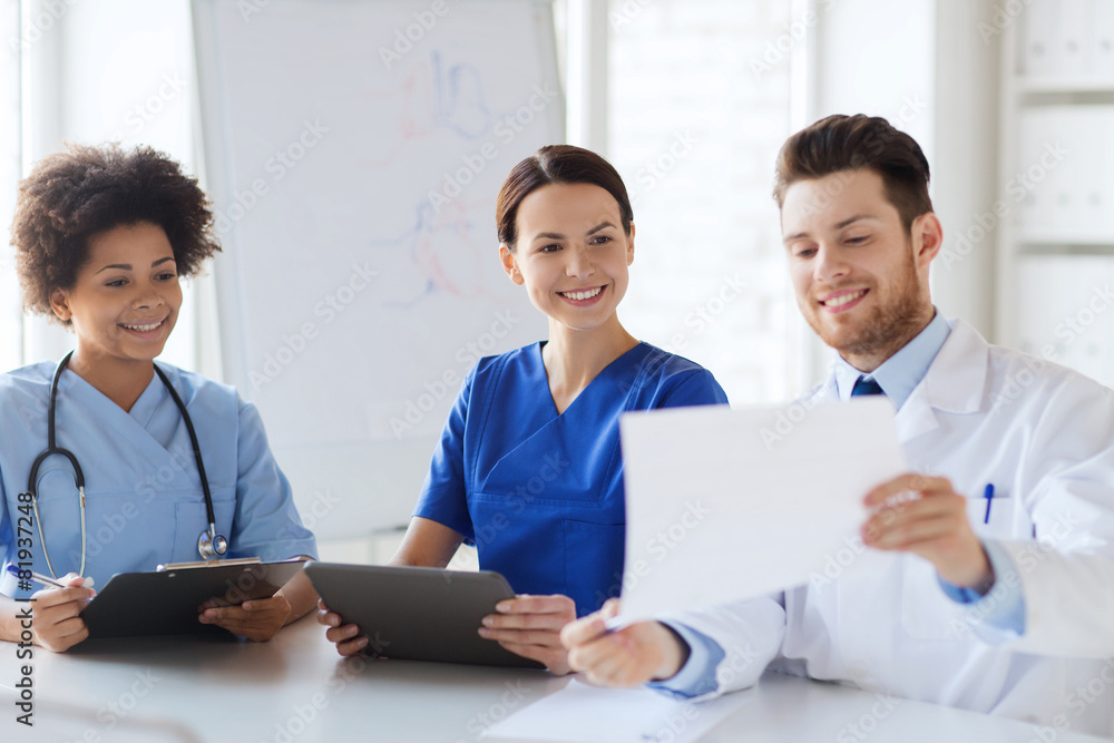 group of happy doctors meeting at hospital office group of happy doctors meeting at hospital office