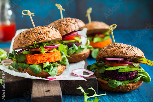 Veggie beet and carrot burgers with avocado photo