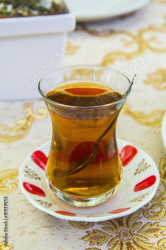 apple Turkish tea in a traditional cup in a cafe