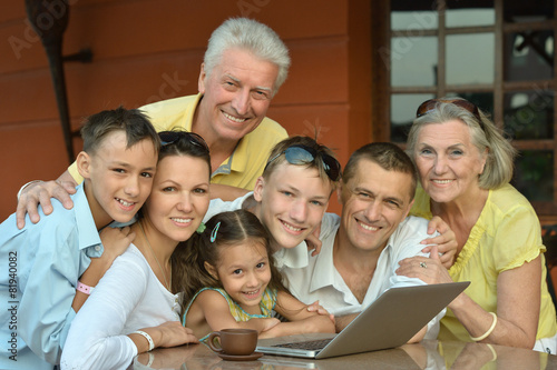 Family sitting with laptop
