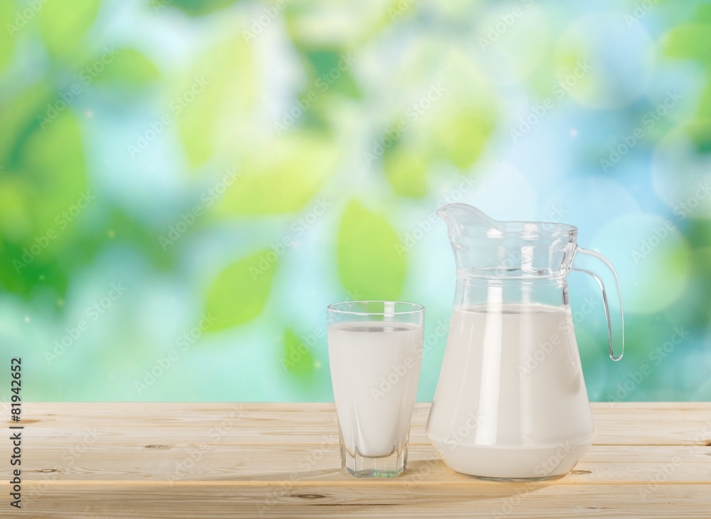 Milk. Milk on table and sunny trees Milk. Milk on table and sunny trees