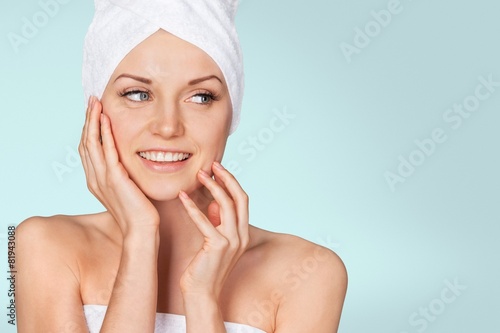 Spa Treatment. Smiling Woman Getting a Facial Treatment