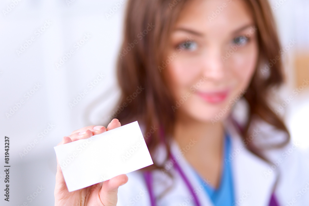 female doctor holding an empty card, isolated on white female doctor holding an empty card, isolated on white