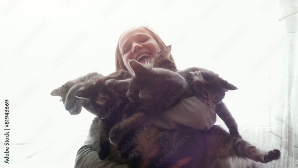 Beautiful smiles brunette girl holding cute kittens Beautiful smiles brunette girl holding cute kittens