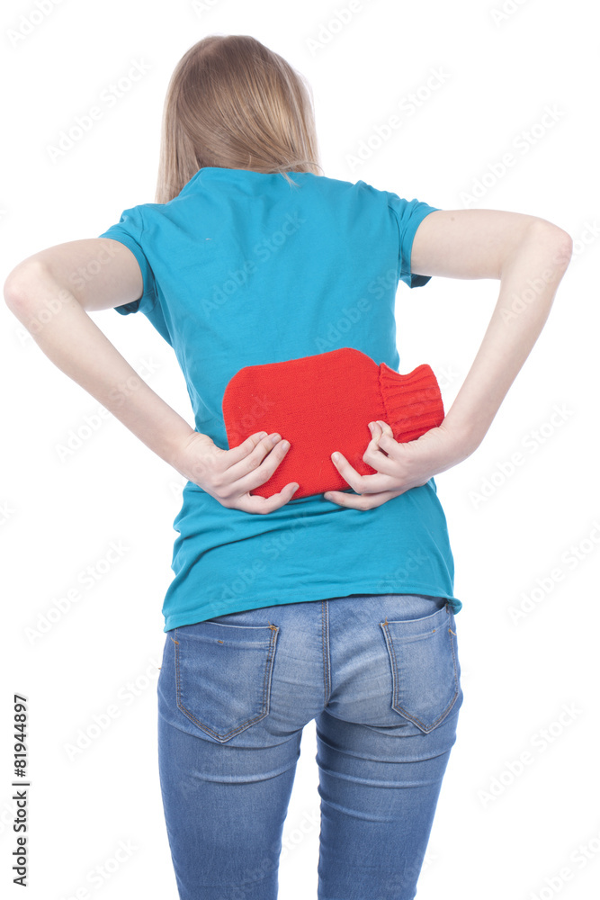 Mädchen mit Rückenschmerzen und Wärmflasche Stock-Foto | Adobe Stock