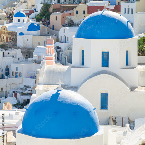 blue tops of church on Santorini in Greece © sergejson