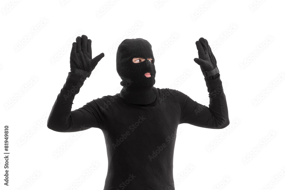 Thief in black costume surrendering to someone Thief in black costume surrendering to someone