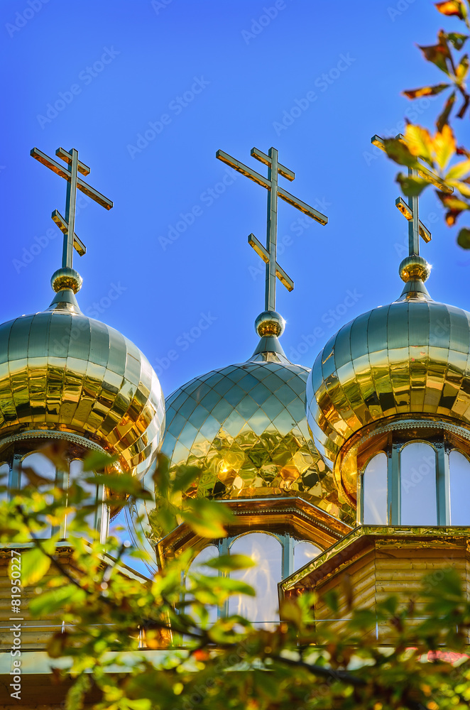 The golden dome on the  wooden russian church