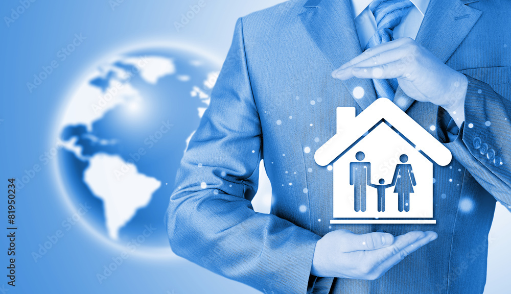 businessman protecting family in home with hands businessman protecting family in home with hands
