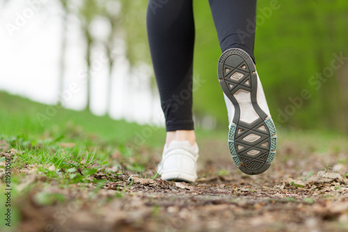 Feet of a running woman
