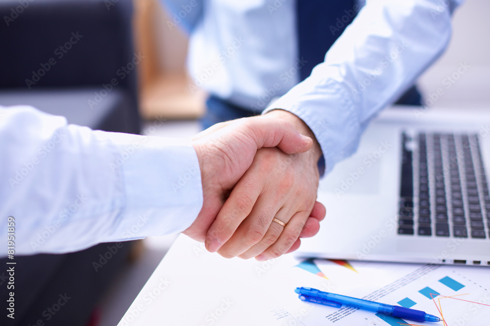 Business people shaking hands, finishing up a meeting Business people shaking hands, finishing up a meeting