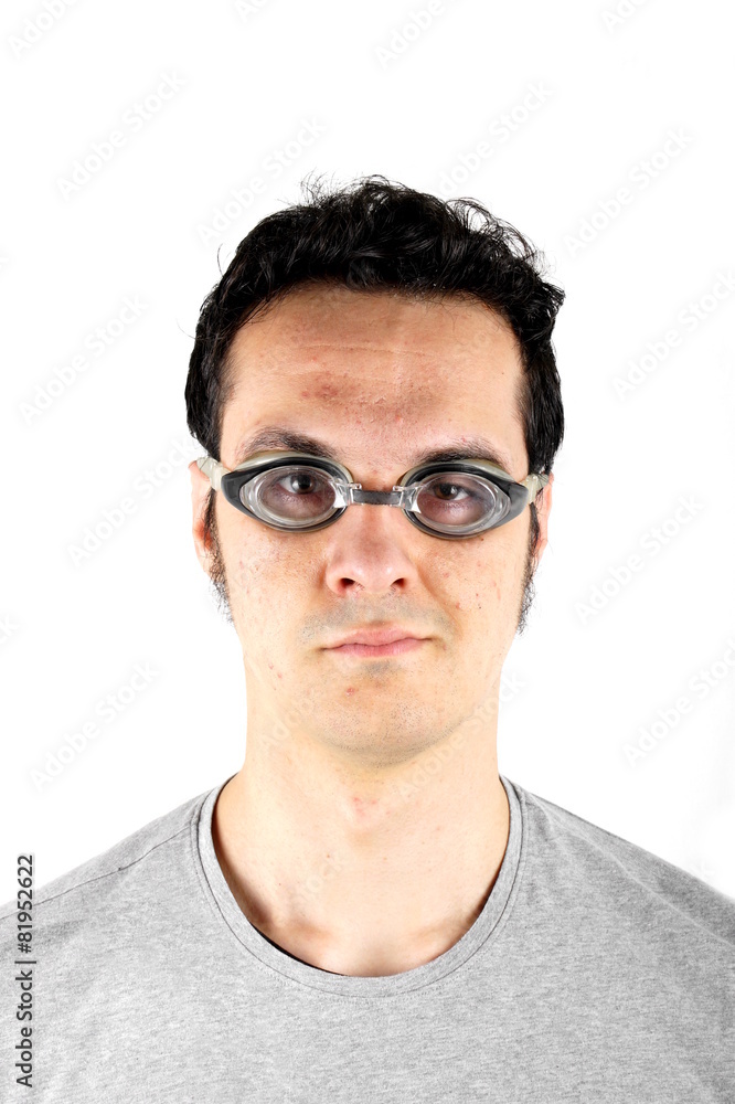 Studio shot of a young man with swimming goggles Studio shot of a young man with swimming goggles