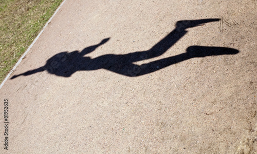 human shadow in flying jump