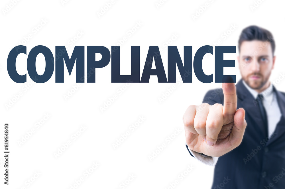 Business man pointing the text: Compliance Business man pointing the text: Compliance