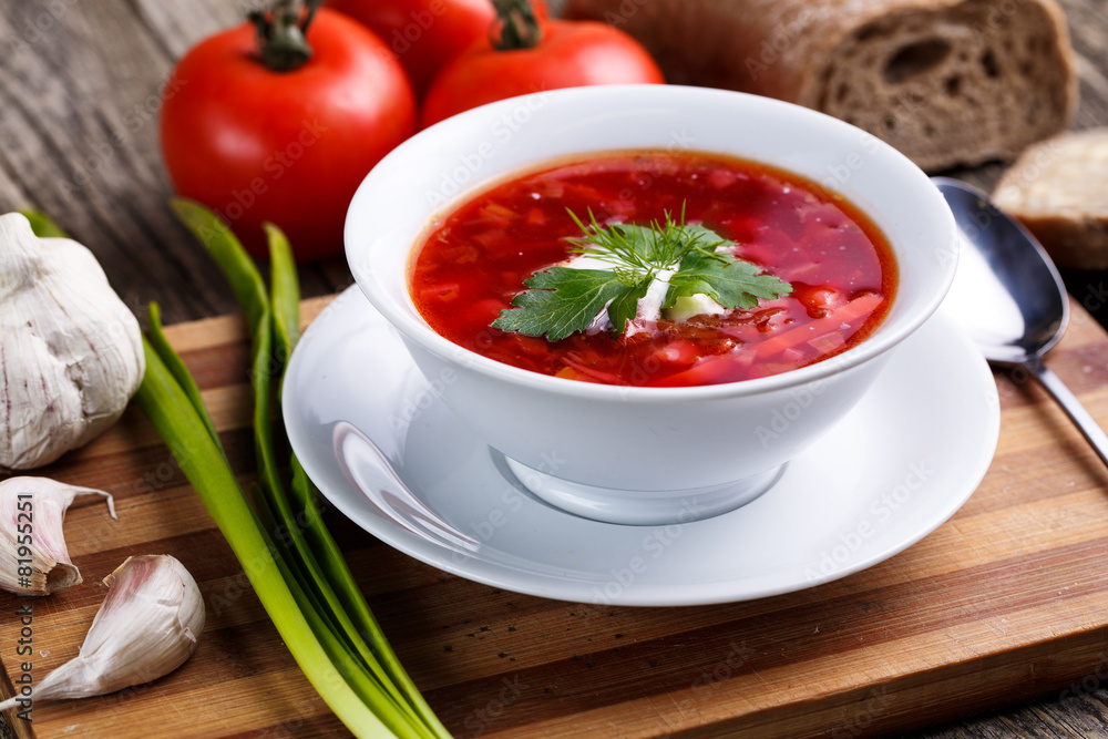 Borsch with bread on a wooden background. Borsch with bread on a wooden background.