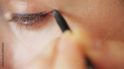Eye make-up closeup - eyepencil and mascara photo