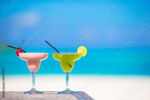 Two tasty cocktails on tropical white beach