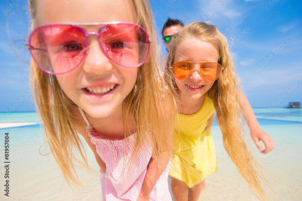 Portrait of beautiful family during summer tropical vacation Portrait of beautiful family during summer tropical vacation