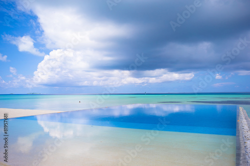 Luxury infinity swimming pool in the tropical hotel