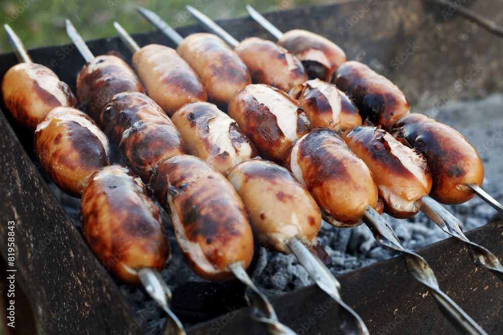 Juicy sausages grilled over charcoal