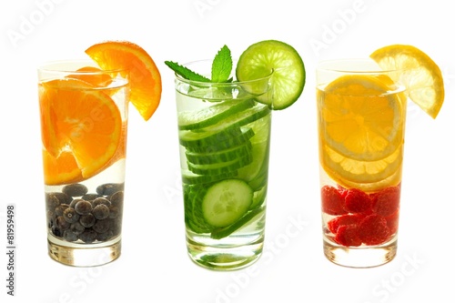 Detox water with fruit in glasses isolated on white