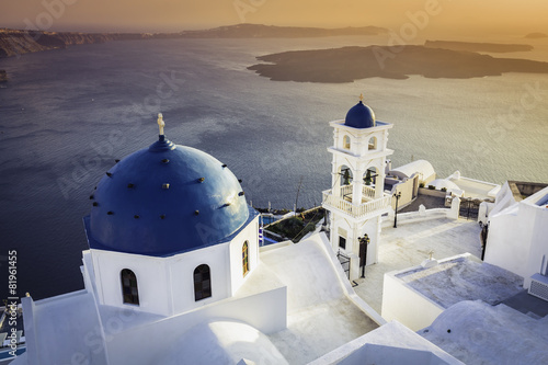 Sunset view of Santorini blue dome churches, Greece