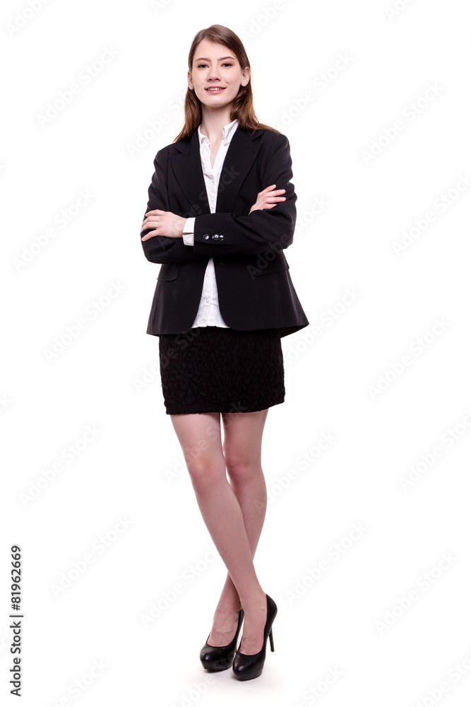 Attractive businesswoman standing arms crossed - Stock image Attractive businesswoman standing arms crossed - Stock image