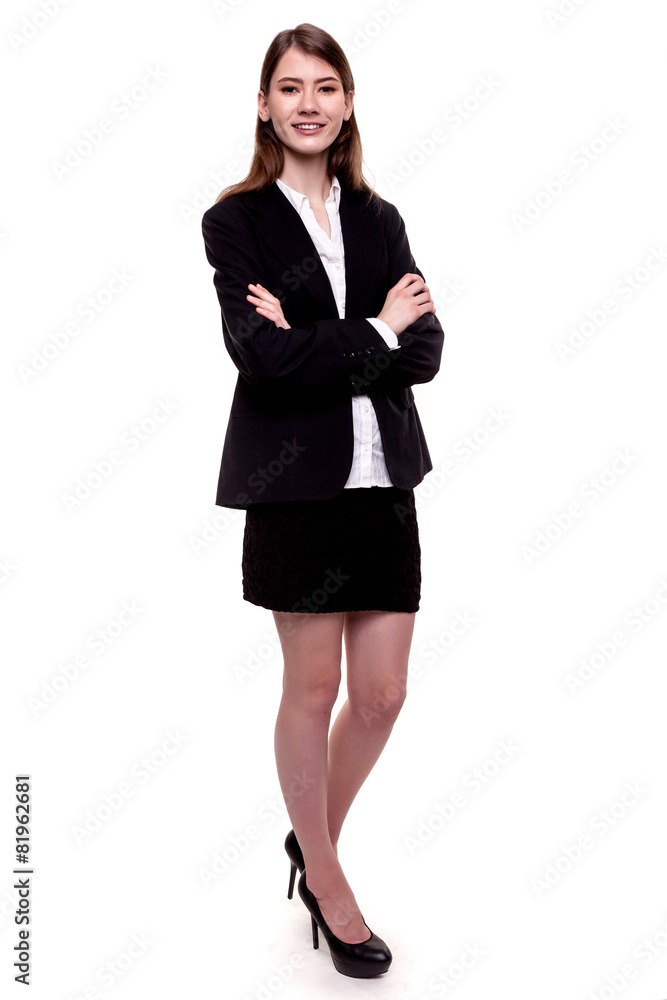 Attractive businesswoman standing arms crossed - Stock image Attractive businesswoman standing arms crossed - Stock image