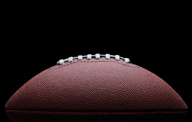 American football over black background