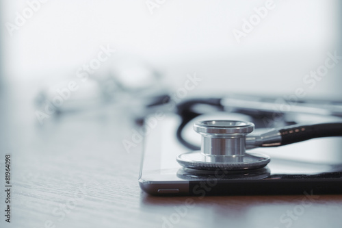 Studio macro of a stethoscope and digital tablet with shallow DO