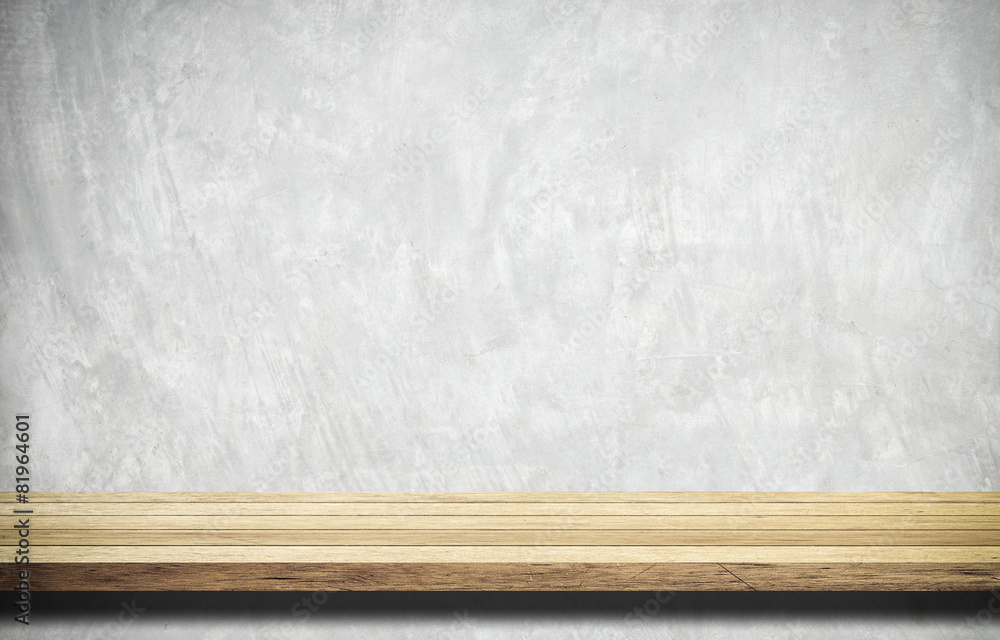 Empty wooden table over white cement wall. Empty wooden table over white cement wall.