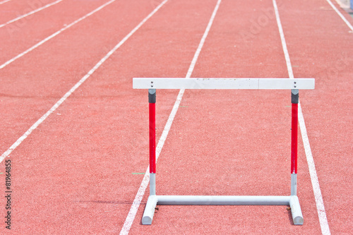 hurdles on the red running track