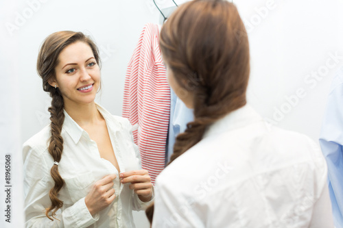 Girl at boutique changing cubicle