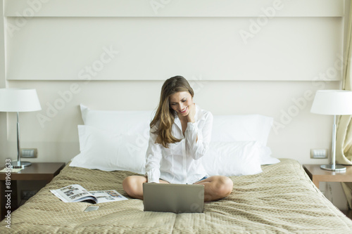 Woman in the bed with laptop