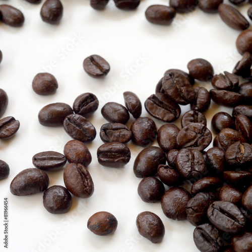 Brown coffee beans isolated on white background