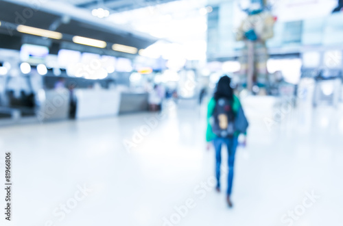 Blurred background : Woman traveler walk in to terminal at airpo