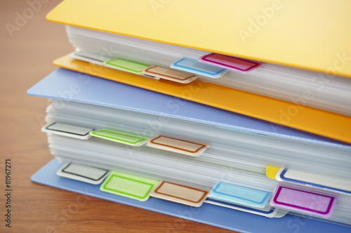 Pile of colorful binders photo