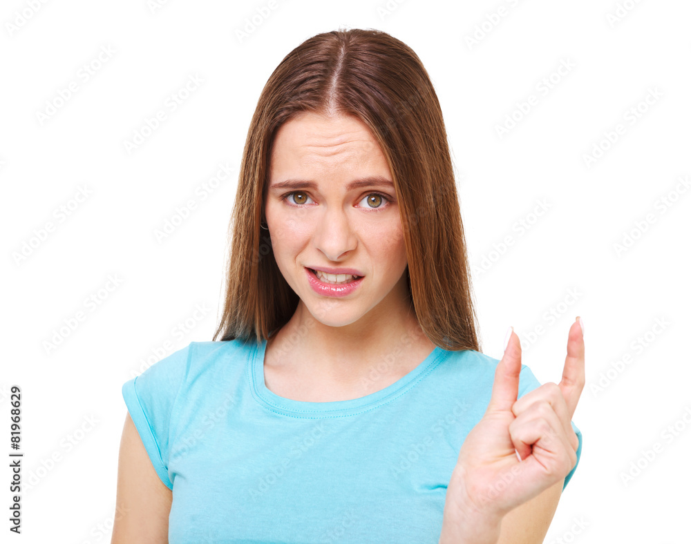 It`s to small! Funny young woman showing something tiny with her It`s to small! Funny young woman showing something tiny with her