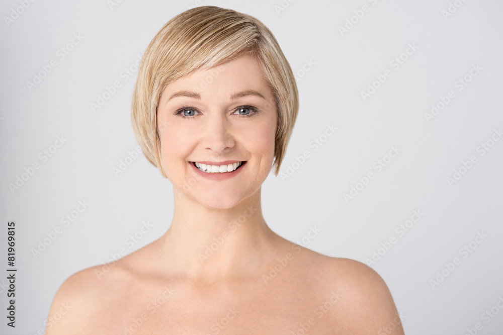 Smiling woman with bare shoulders Smiling woman with bare shoulders