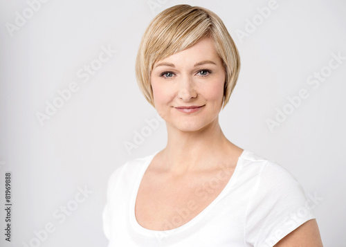 Casual pose of smiling mid woman