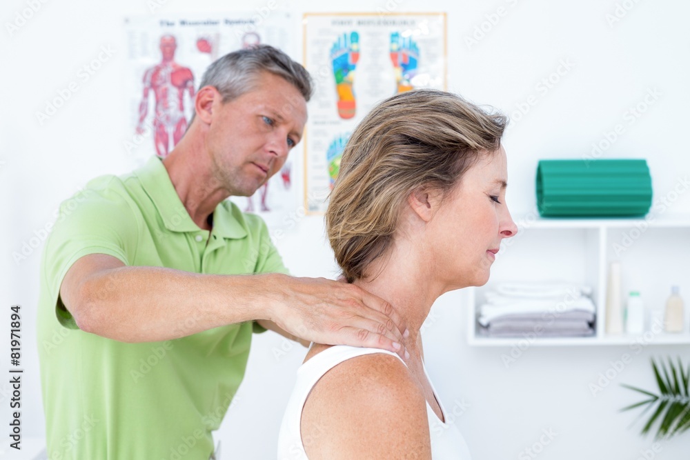 Fototapeta premium Doctor doing back adjustment