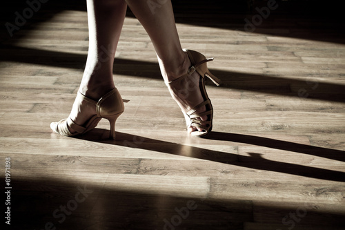 Female feet on the dance floor