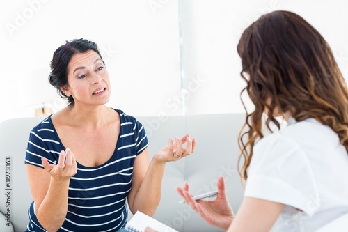 Depressed woman talking with her therapist