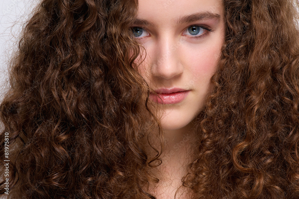 Young female fashion model with curly hair Young female fashion model with curly hair