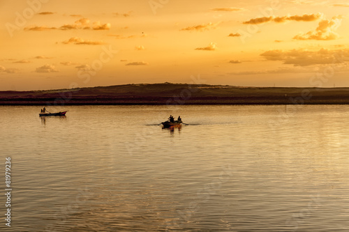 Traditional fishing boats at sunset in Suez canal, Egypt © senai aksoy