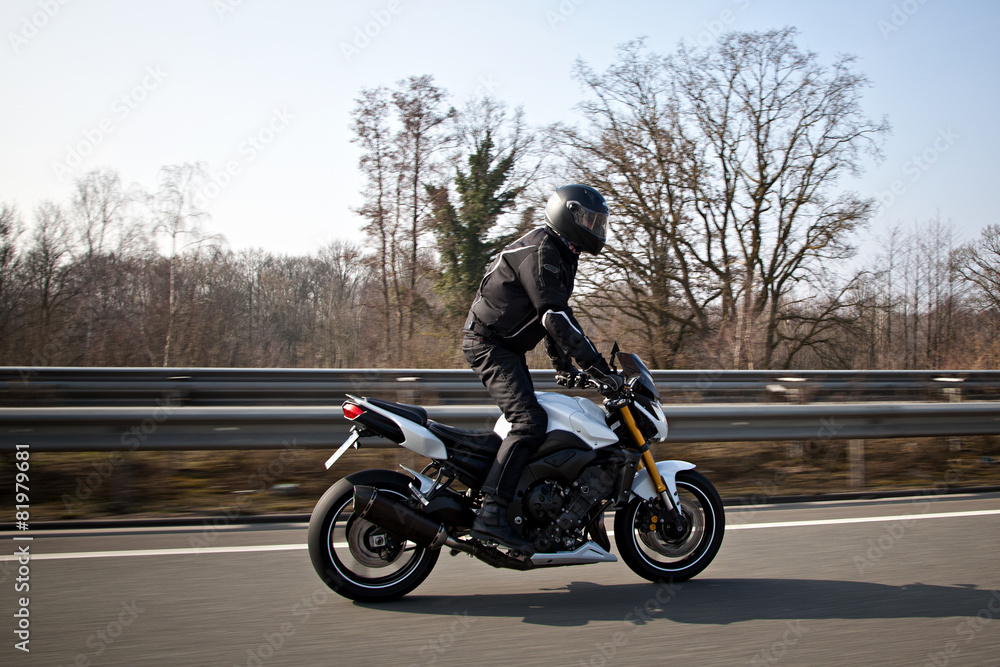 Motorcyclist biker on the road