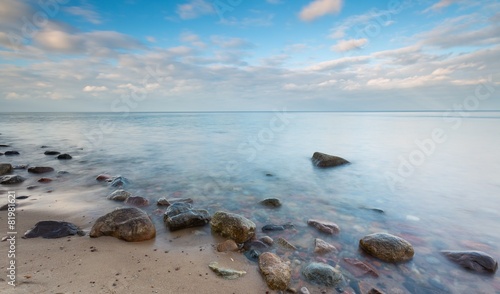 Beautiful long exposure landscape of rocky sea shore